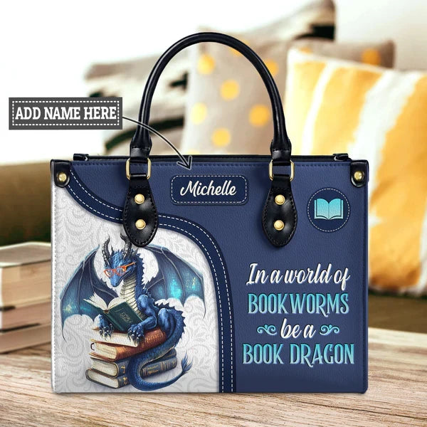 In A World Of Bookworms Be A Book Dragon Leather Bag