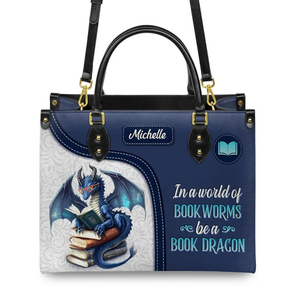 In A World Of Bookworms Be A Book Dragon Leather Bag