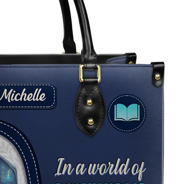 In A World Of Bookworms Be A Book Dragon Leather Bag