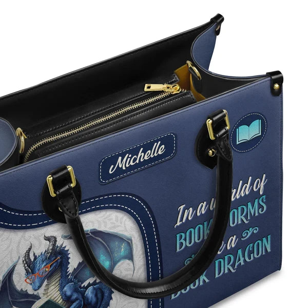 In A World Of Bookworms Be A Book Dragon Leather Bag